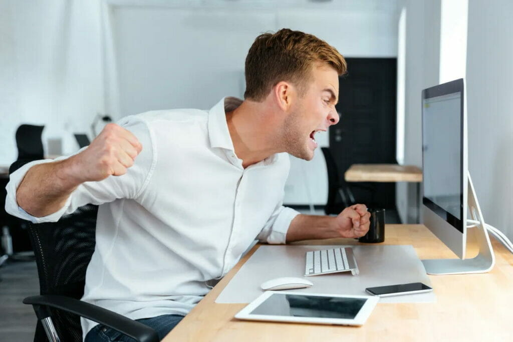 employee showing anger on his computer screen