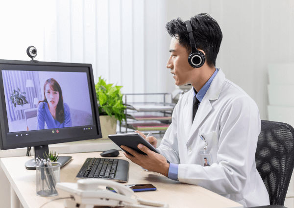 male telehealth psychiatrist talking online with his patient