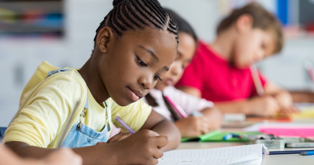 child in class thinking hard